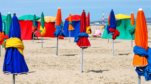Colorful Beach Umbrellas on Normandy Coast with Copy Space
