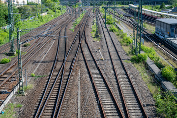Fototapeta premium Diverging railway tracks symbolizing decisions and direction
