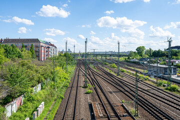 Railway tracks leading towards Berlin skyline with TV Tower in Germany © Inga