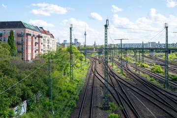 Railway tracks leading towards Berlin skyline with TV Tower in Germany © Inga