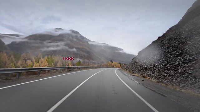 Remote Mountain Road Through Autumn Forest And Foggy Altai Passes With Atmospheric Journey Along Chuysky Trakt Across Wild Siberian Landscape