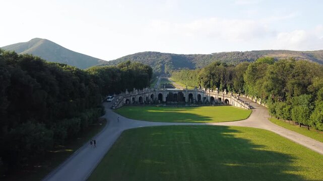 Wide aerial panorama of Caserta Royal Palace and historic park in summer season