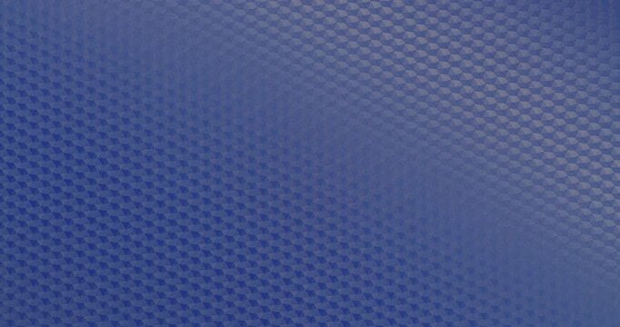 Blue Geometric Texture Rotation. Smooth continuous rotation of vibrant blue geometric  pattern texture.  Loop with subtle light reflections gliding across the surface.