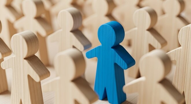Blue wooden figure stands out from crowd of beige figures