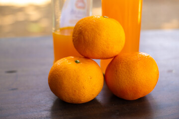 Fresh mandarin oranges stacked on top, showcasing natural, vitamin-rich freshness with vibrant colors and a healthy appeal. © Khoirul