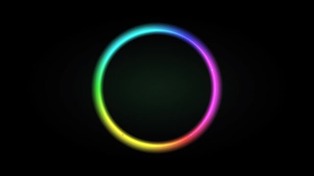 Glowing rainbow neon circle ring rotating on black background for logo reveal intro loop