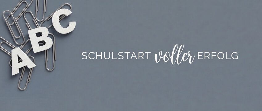 School start success concept with wooden ABC letters and paperclips on gray background banner orientation for education, learning, first day of school, academic growth, and classroom organization.