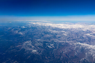 Fototapeta premium aerial view of white snow mountains