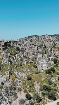 Abandoned ghost town Anavatos, ruined buildings on cliff mountain on Chios island, Greece