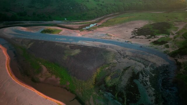 Sunrise at Three Cliffs Bay in Wales. Drone flight
