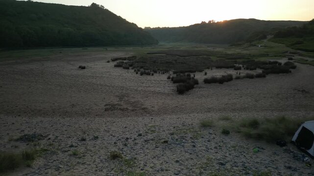 Sunrise at Three Cliffs Bay in Wales. Drone flight