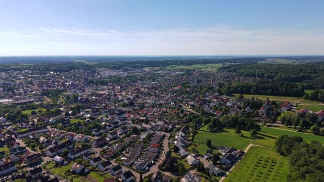 Birds eye view of the historic center of Krumbach, Bavaria. Scenic drone panorama of the rural town landscape and green nature in Southern Germany in summer. 