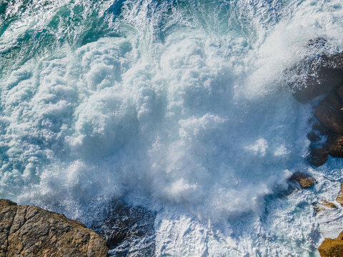 Waves Crashing on the Rocks with violence