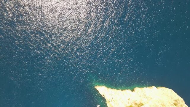 Overhead aerial view of beautiful ocean with turquoise water and natural seascape