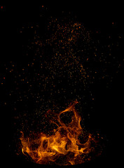 Vivid flames erupt from dark background