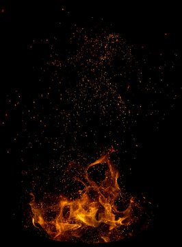 Vivid flames erupt from dark background