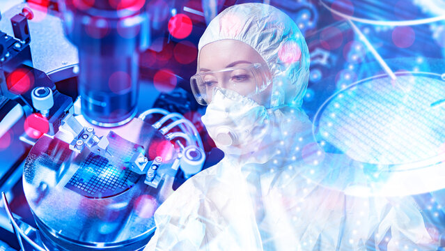 Semiconductor manufacturing, Cleanroom technician inspects silicon wafer with precision equipment for microchip production.