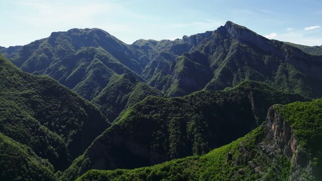 Albanian Mountain tops in the spring. Shot near the Shala River, in 4k at 60 fps on a DJI Mini 3 Pro. Becautiful scencis mountain ranges covered in lush forest. Raw Footage (uncolorgraded), D-Log film