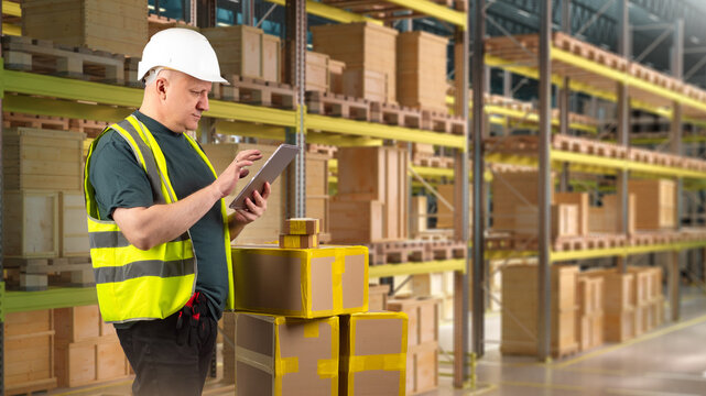 Warehouse logistics, inventory control. Supervisor checks packages with tablet among storage racks, managing stock and shipment processing.