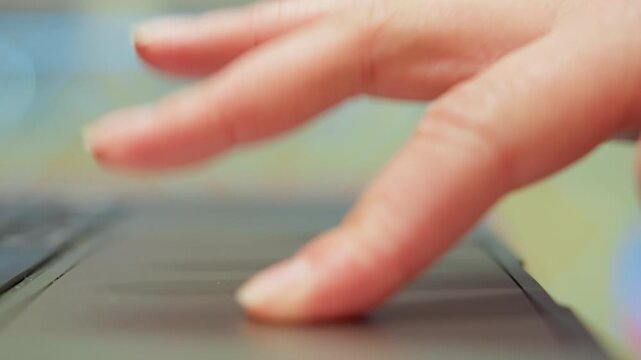 Student practicing gestures during study. Caucasian hand performing repeated tap and swipe motions during training. Focused closeup of hand executing trackpad gestures for online learning session