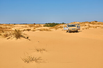 Off-Road Vehicle in Sand Dunes © Ryzhkov Oleksandr