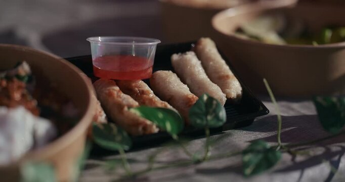 Spring rolls with dipping sauce served at Kvatric Market in Zagreb Croatia.