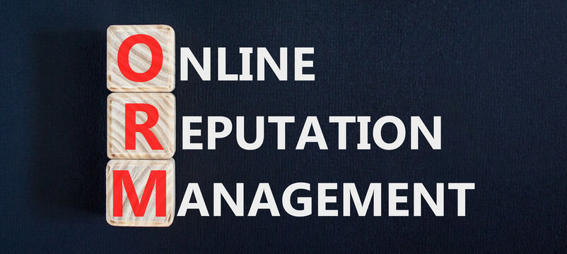 ORM online reputation management symbol. Concept words ORM online reputation management on beautiful wooden blocks. Beautiful black background. Business ORM concept. Copy space.