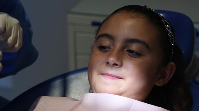 Dentist check-up for young girl. Dental cleaning. Slow motion