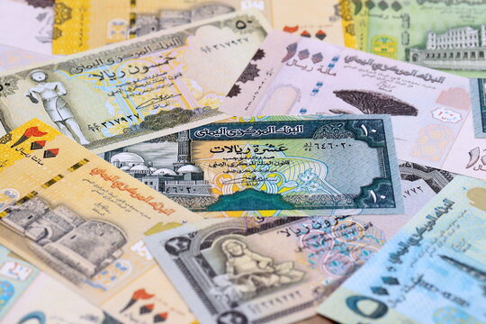 Yemeni rial money bills pile on table. Yemen banknotes of YER currency close up.