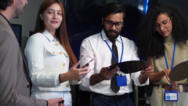 Professional IT expert group inspecting silicon wafer disc semiconductor material component during hardware tech development presentation research project in office workspace