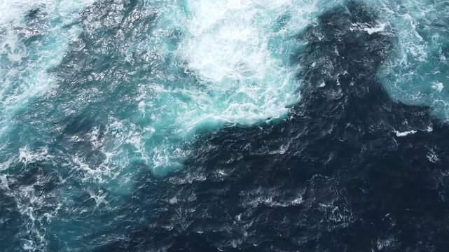 Top down drone view of turquoise waves on Western Australia coast