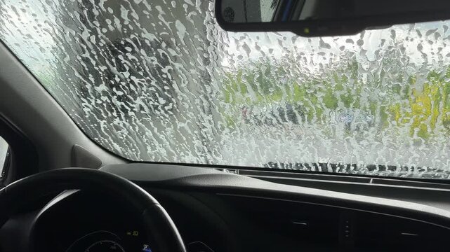 Automatic car wash point of view from inside vehicle