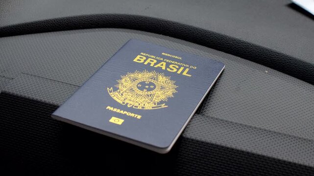 Brazilian passport highlighted on the dashboard, symbolizing travels and adventures. Exploring the world: Brazilian passport featured on the vehicle's dashboard.