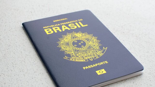 Close-up of the Brazilian passport against a white background, symbolizing travel and citizenship. Clear image of a Brazilian passport on a white background, emphasizing authenticity and simplicity.