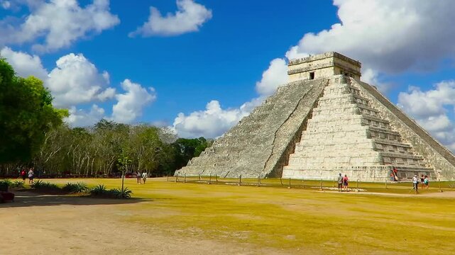 Chichen Itza, Yucatan, Mexico - March 3 2017: El Castillo, Mayan pyramid, Temple of Kukulcan. El Castillo step pyramid under the blue sky. Ancient mayan mexican temple and sunny day.