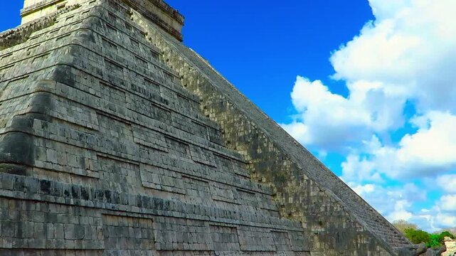 Mayan pyramid in the Chichen Itza. El Castillo mayan pyramid in Mexico. Mexican historical indian monument. Travel footage, pyramids under the blue sky.
