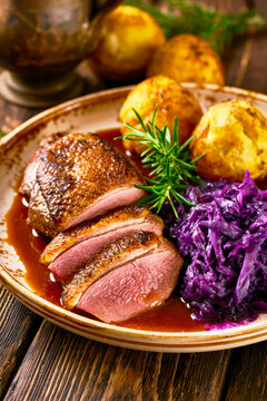 Crispy Roasted Duck Breast With Red Cabbage and Dumplings. AI generative.