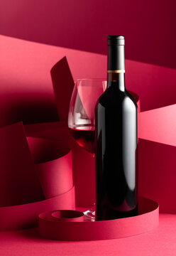 Bottle and glass of red wine.
