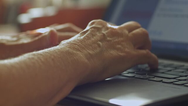 A woman types a comment on a laptop and posts it on social media