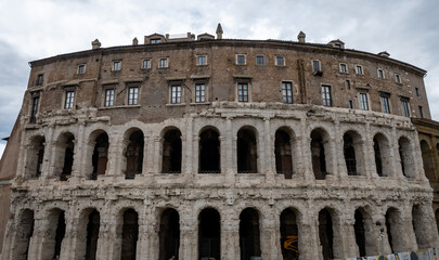 Obraz premium Architectural history in details of ruins, old buildings, walls, amfitheatres, arches in old part of Rome, dated from 300 BC, guided tours in Rome, Italy