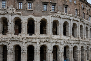 Naklejka premium Architectural history in details of ruins, old buildings, walls, amfitheatres, arches in old part of Rome, dated from 300 BC, guided tours in Rome, Italy