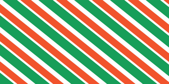 Christmas seamless pattern. Red and green diagonal stripes background. Candy cane repeating decoration wallpaper. Winter holiday lines backdrop. Xmas peppermint present wrapping print design.