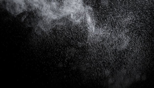 the texture of rain and fog on a black background creates a dramatic overlay effect with abstract splashes of rain and snow particles in freeze motion