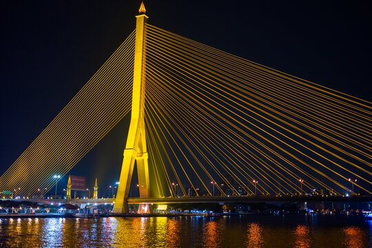 Norarat Sathan Bridge illuminated at night in Bangkok