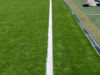 Obraz premium Touchline on green football pitch with drain
