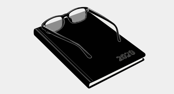 A close-up of a black planner or journal from 2020 with glasses resting on top