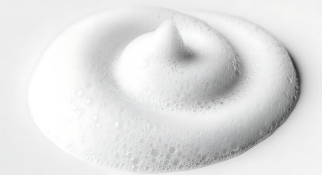 A close-up view of a swirl of whipped cream in a spiral pattern