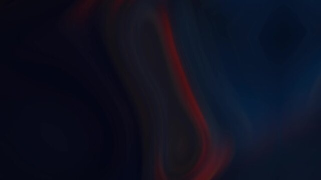 Abstract dark background featuring soft, swirling gradients of deep blue and warm orange, creating a fluid, mysterious, and artistic motion effect.