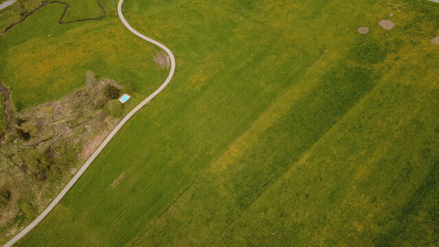 Aerial drone view of farmland fields and rural landscape in spring