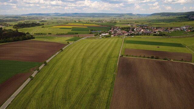 Aerial drone view of colorful farmland fields and rural countryside